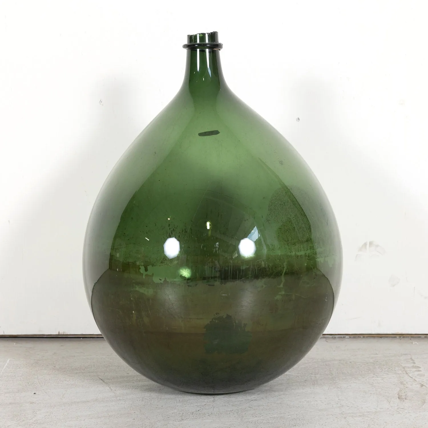 Grand 19th Century French Handblown Dark Green Glass Demijohn or Dame Jeanne Bottle